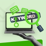 Magnifying glass over the word 'keyword' on a laptop screen, representing keyword research for SEO.